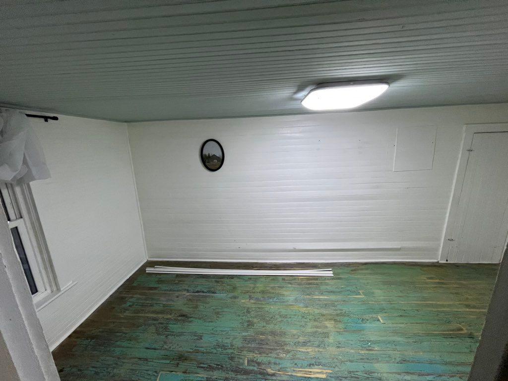 Basement before: painted concrete floor